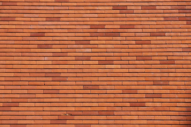 istock Background of old vintage dirty brick wall with peeling plaster, texture 1020010534