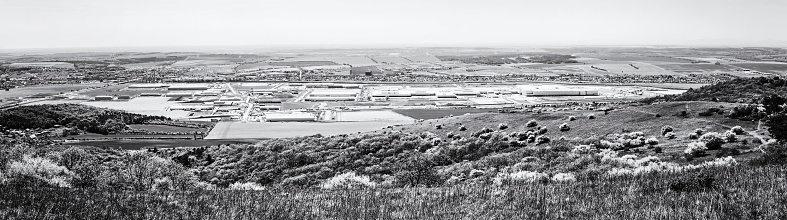 Industrial park in Nitra, Slovak republic. Panoramic photo. Seasonal natural landscape. Black and white photo.