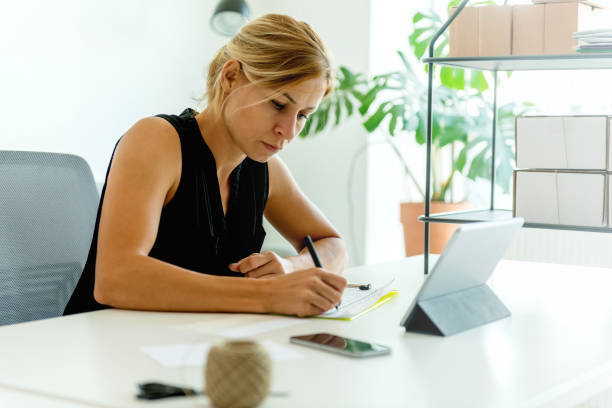 istock Writing addresses for sending packages 1020012440