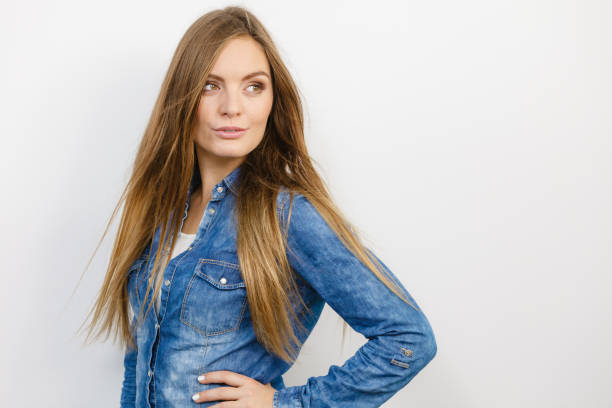 Fashion, denim, people concept. Young girl with denim jacket. Lady is wearing jeans shirt.