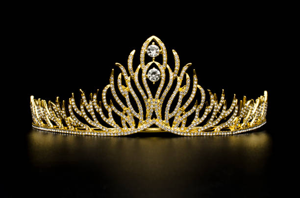 istock gold diadem with diamonds isolated on black 1020025626
