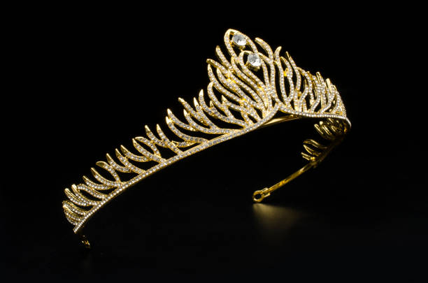 istock gold diadem with diamonds isolated on black 1020025696