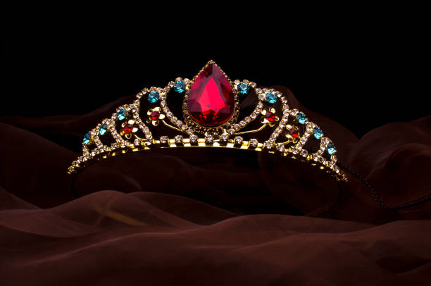 istock gold diadem with red ruby stone isolated on the fabric 1020025890