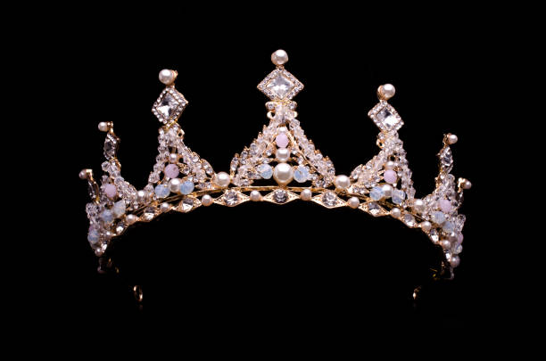 istock golden crown with pearls and beads isolated on black 1020025906