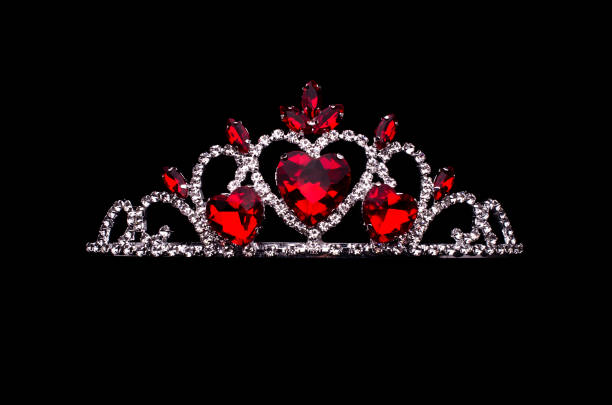 silver crown with hearts, rubies and diamonds isolated on black