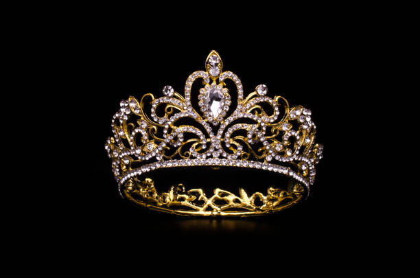 istock gold crown with diamonds isolated on black 1020026010