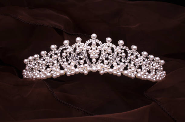 istock silver diadem with diamonds and pearls isolated on the fabric 1020026050