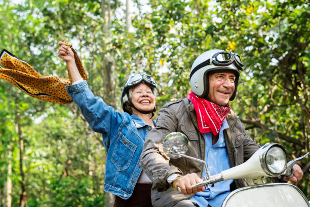 istock Senior couple riding a classic scooter 1020026394