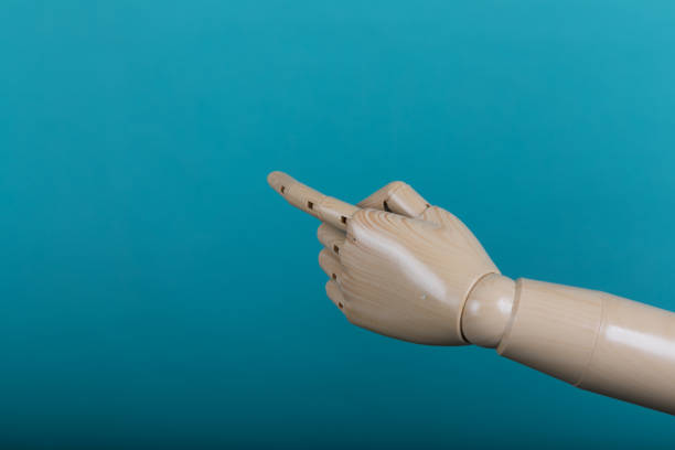 istock Closeup of male hand pointing. Isolated on light background 1020037020