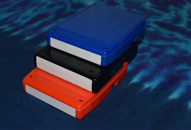 Colorful 8 track tapes on blue background