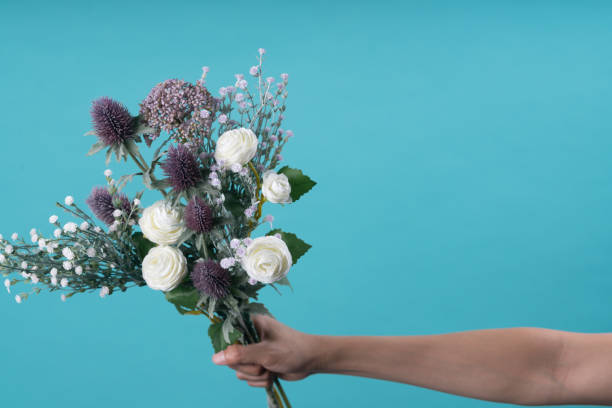 istock wild and beautiful flower bouquet on light background. 1020037298