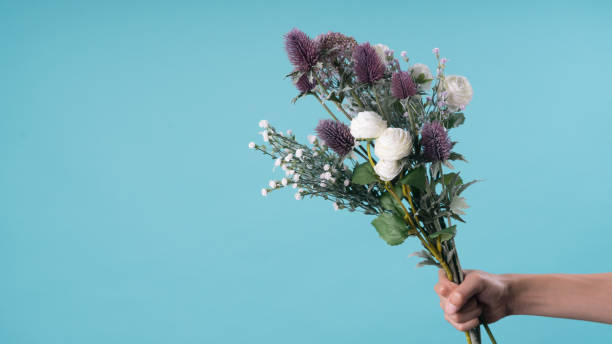 istock wild and beautiful flower bouquet on light background. 1020037312