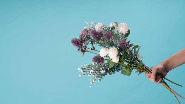 istock wild and beautiful flower bouquet on light background. 1020037324