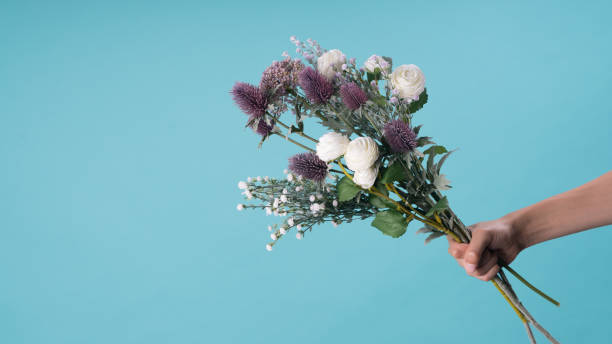 istock wild and beautiful flower bouquet on light background. 1020037344