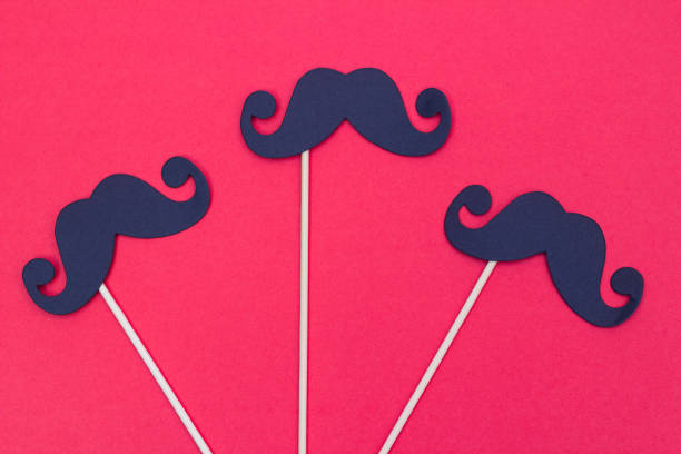 istock Photo booth props black Mustaches on red background 1020040770