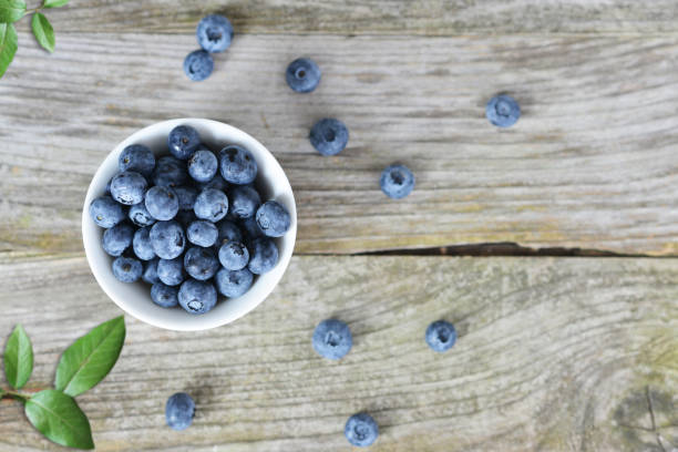 istock Blueberries on wooden background, fresh and healthy snack 1020041262