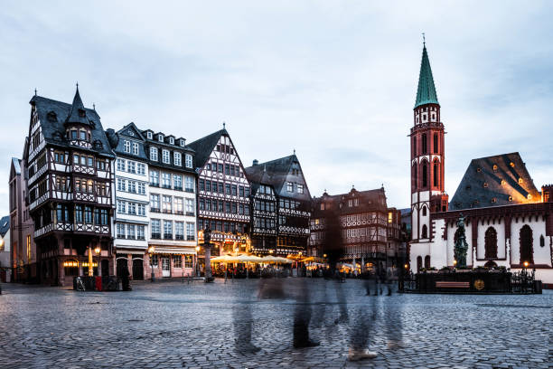istock People in Frankfurt old town square at dusk 1020049188