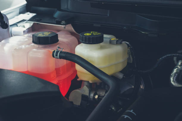 Coolant tank and warning information in engine room Coolant tank and warning information in engine room coolant stock pictures, royalty-free photos & images