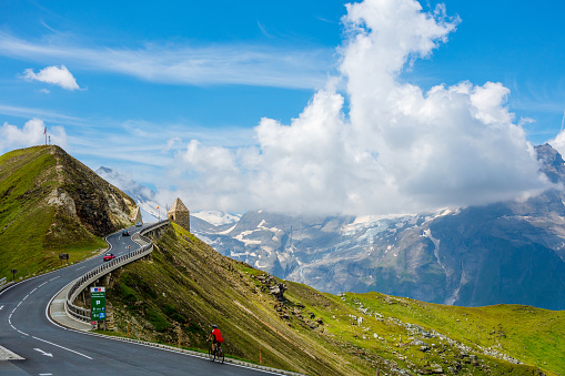 Picturesque summer mountain landscape of Durmitor National Park, Montenegro, Europe, Balkans Dinaric Alps. Durmitor panoramic road, Sedlo pass. Motorcyclist and motorcycle model unrecognizable.