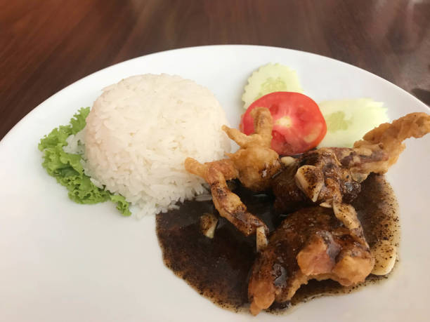 istock Stir fried soft shell crab with black pepper sauce served with jasmine rice 1020057148