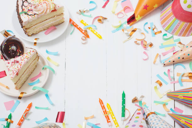 istock birthday cake and  decoration on white wooden background 1020063270