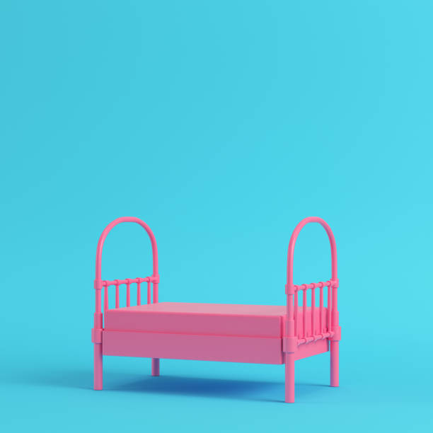 istock Pink single bed on bright blue background in pastel colors. Minimalism concept 1020063372