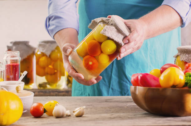 istock vegetables preserved in jar in hand 1020063380
