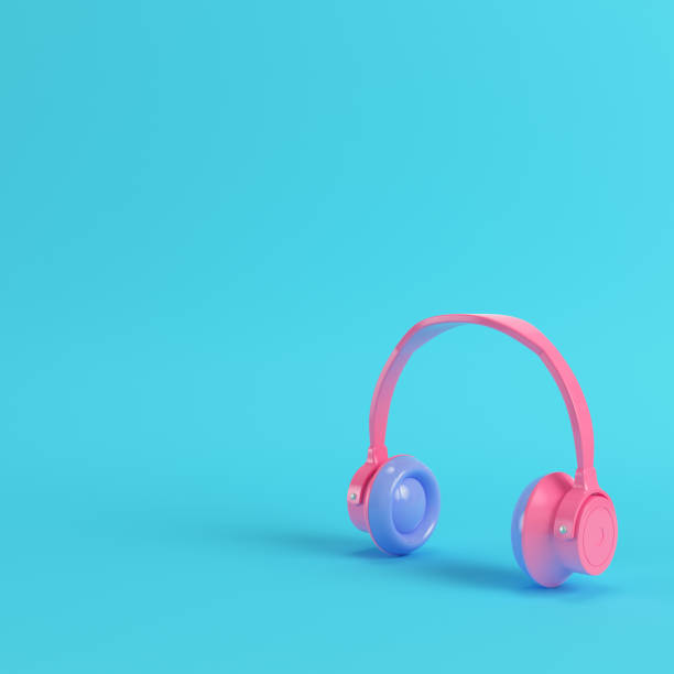 istock Pink headphones on bright blue background in pastel colors 1020063612