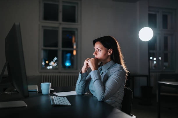 istock Side view of exhausted young woman working overtime. 1020066802
