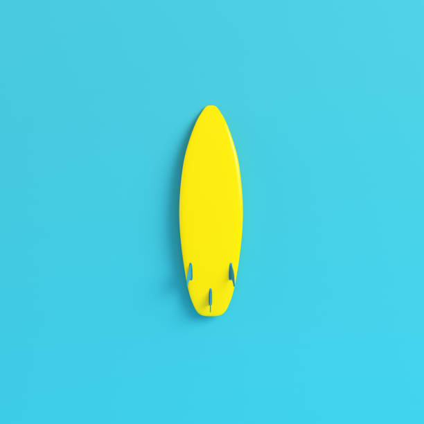 istock Yellow surfboard on bright blue background in pastel colors 1020067560