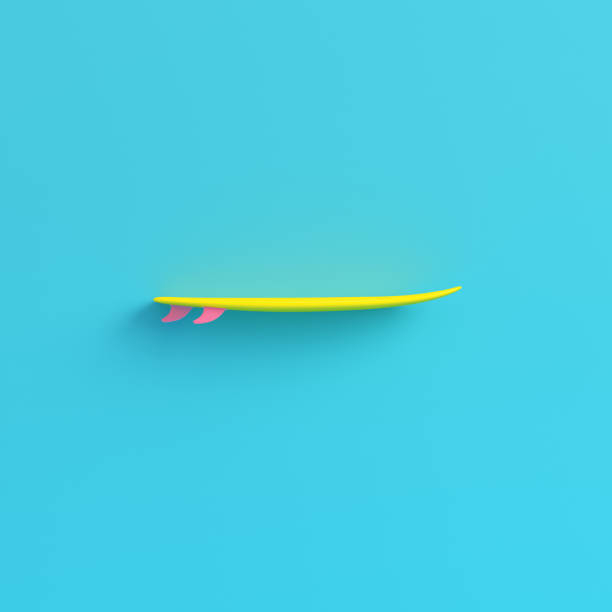 istock Yellow surfboard on bright blue background in pastel colors 1020067594