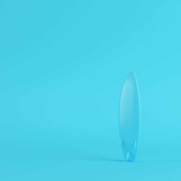 istock Surfboard on bright blue background in pastel colors. Minimalism concept 1020067676
