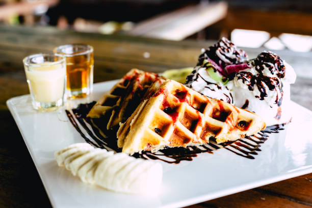 istock waffle with ice cream chocolate and whipping cream 1020076330