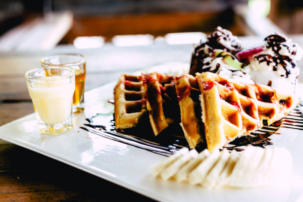 istock waffle with ice cream chocolate and whipping cream 1020076412