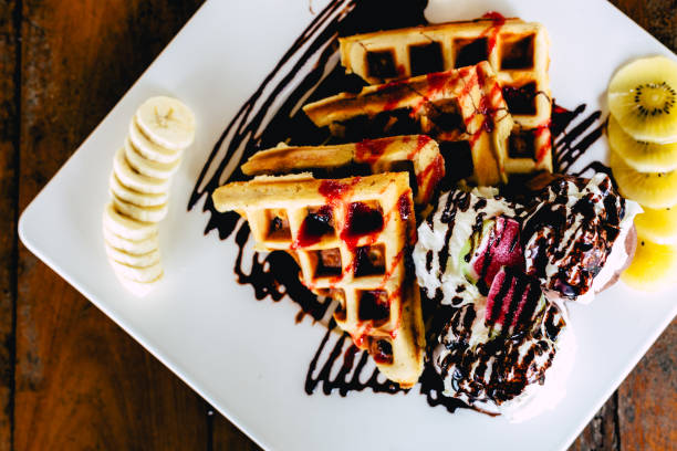 istock waffle with ice cream chocolate and whipping cream 1020076424