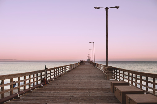 Sunset at Avila Beach pier with purple skies