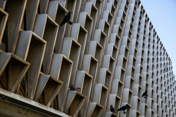 istock Building facade with windows repetition, side view with blue sky behind, repetition shape conceptual art 1020088768