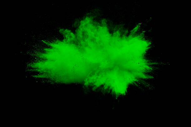 istock Green color powder explosion cloud isolated on black background.Green dust splash on dark background. 1020102802