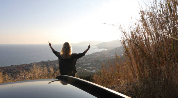 istock Woman looks down at Italian coastline 1020104632