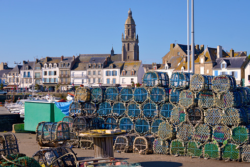 Stack of lobster pot and Notre-Dame-de-Pitié church at Le Croisic, a commune in the Loire-Atlantique department in western France