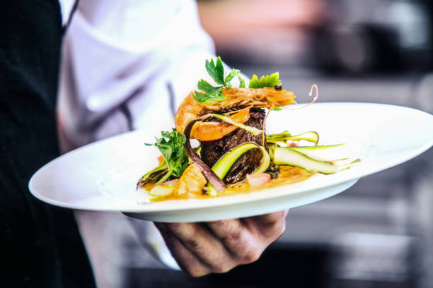 istock Modern food stylist decorating meal for presentation in restaurant 1020108992