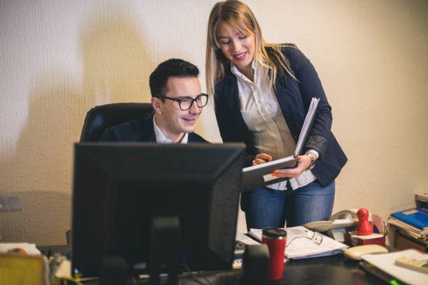 istock Business teamwork - two business partners working together on laptop at workplace 1020118440