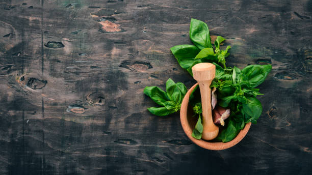 istock Fresh green basil. Top view. On the background. Free space for text. 1020118806