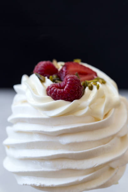 istock Pavlova cakes with cream and fresh summer berries 1020118958