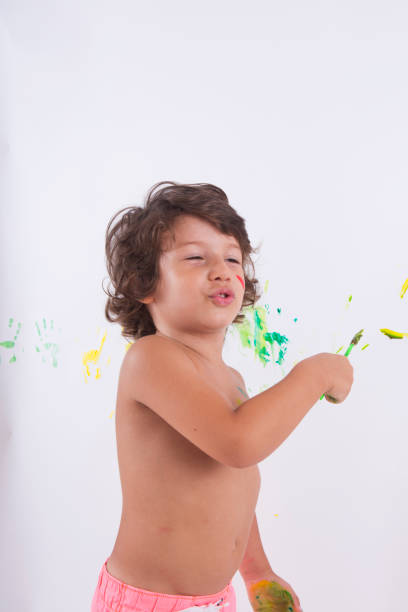 istock Happy Child Finger painting. 1020119522