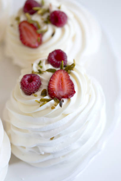 istock Pavlova cakes with cream and fresh summer berries 1020120242