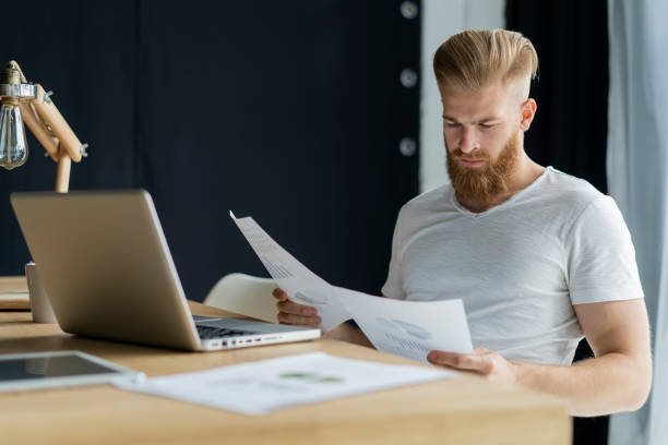 istock Handsome businessman working with laptop in office. 1020122648