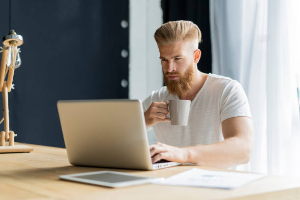 istock Handsome businessman working with laptop in office. 1020122696