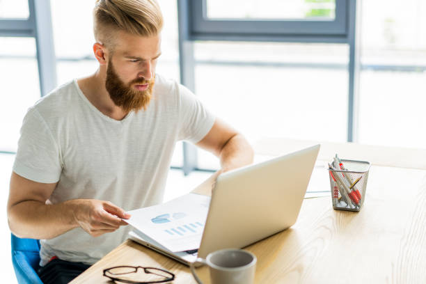 istock Handsome businessman working with laptop in office. 1020122710