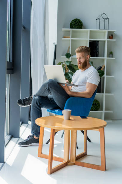 istock Handsome businessman working with laptop in office. 1020134036